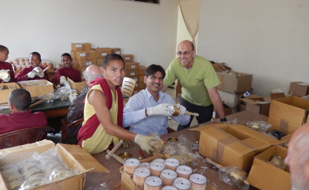 assembling prayer wheels at the Sarnath Institute